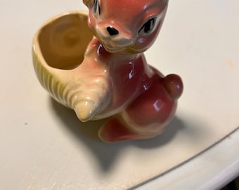 Vintage Pink Rabbit Holding Green Vegetable ceramic planter.