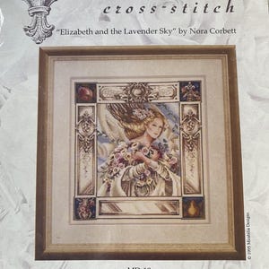 May include: A Mirabilia cross-stitch kit titled "Elizabeth and the Lavender Sky" by Nora Corbett. The framed design features a woman with flowing hair and floral accents. Design size is 12 1/2" x 12 3/4".