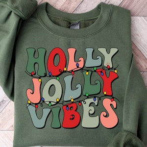 ホーリージョリーメリークリスマススウェットシャツ、メリー＆ブライトクリスマスシャツ、かわいいクリスマスギフト、クリスマスパーティーシャツ、クリスマスホリデーセーター
