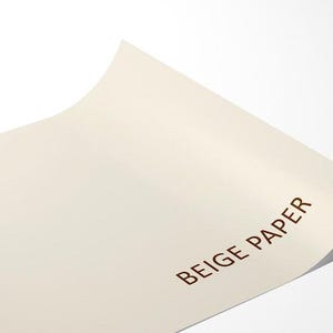 A close-up image of a piece of beige paper with the text "BEIGE PAPER" printed on it.