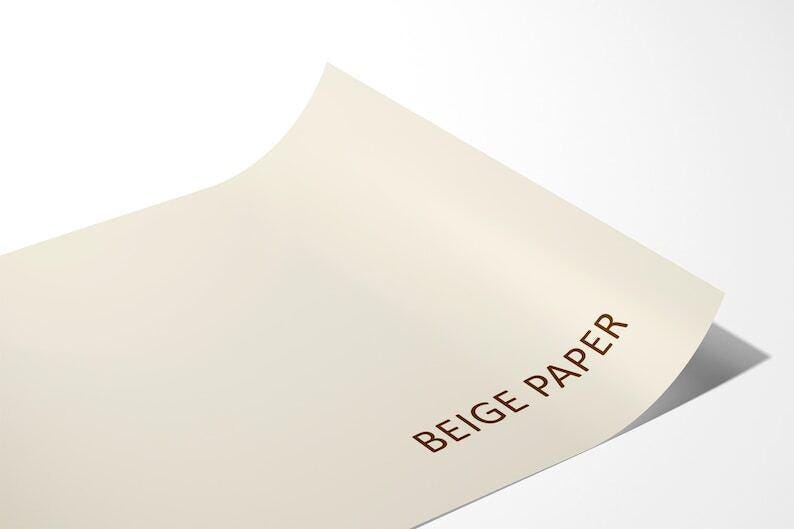 A close-up image of a piece of beige paper with the text "BEIGE PAPER" printed on it.
