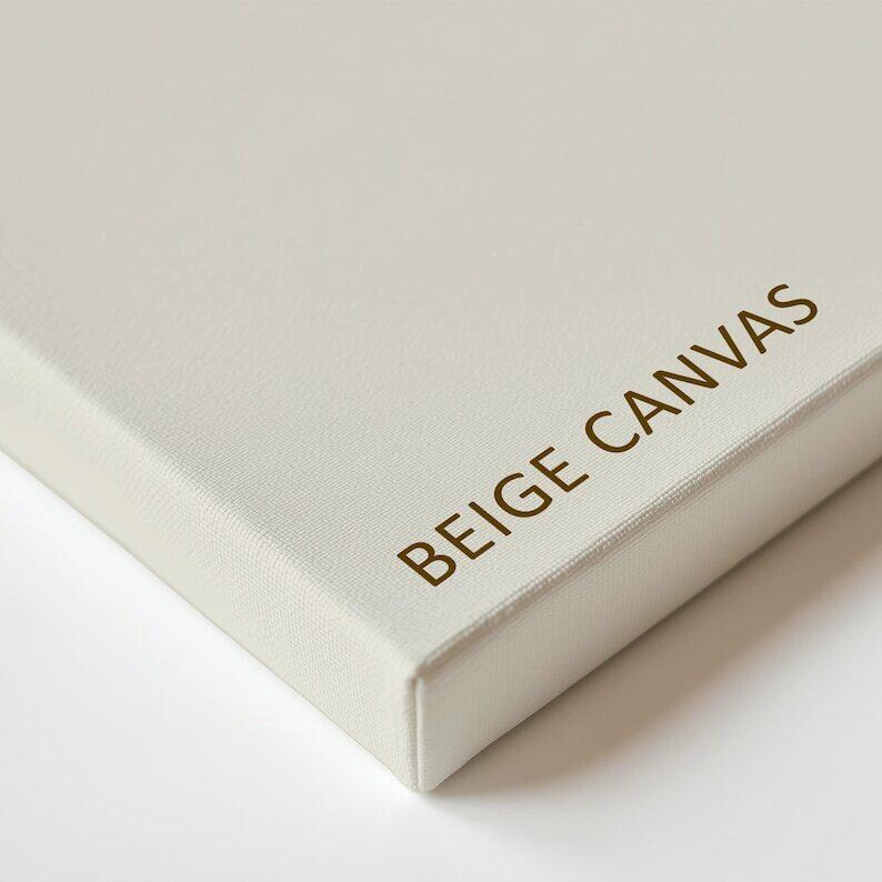 a close-up view of a cream-colored canvas or board with the text "BEIGE CANVAS" printed on it.