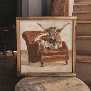 Longhorn Steer Sitting in a Leather Chair. Fine Art Print by Ethan Harper. Cow Art and Home Decor
