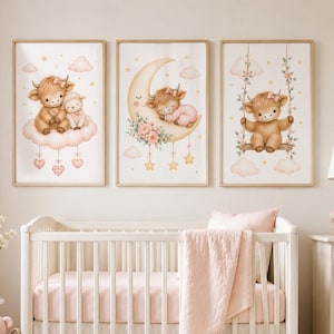 May include: Three framed wall art prints featuring illustrations of a fluffy highland cow. The first shows a cow and lamb on a cloud, the second a cow sleeping on a crescent moon, and the third a cow on a swing. All prints have a soft pink colour palette.