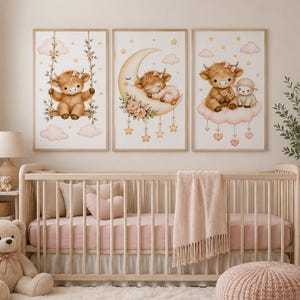 May include: Three framed wall art prints featuring illustrations of a brown highland cow calf. The first shows the calf on a swing, the second shows it sleeping on a crescent moon, and the third shows the calf sitting on a cloud with a small lamb.