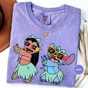 a purple shirt with a picture of two cartoon characters on it