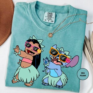 a t - shirt with a picture of two cartoon characters on it