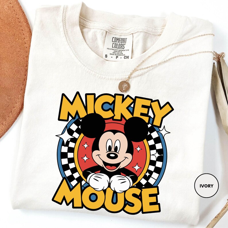 a mickey mouse t - shirt on a white background