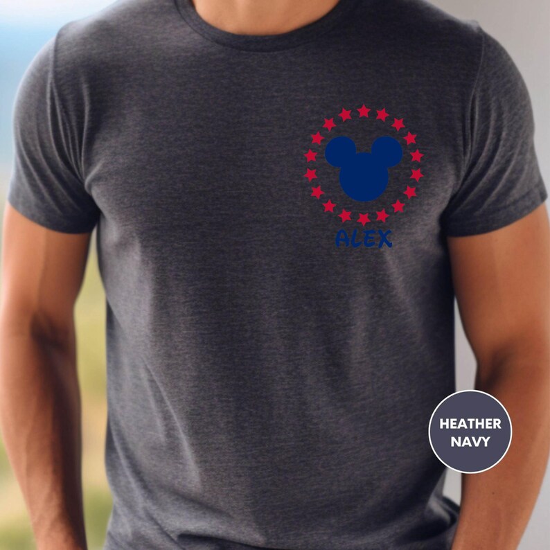 a man wearing a mickey mouse t - shirt