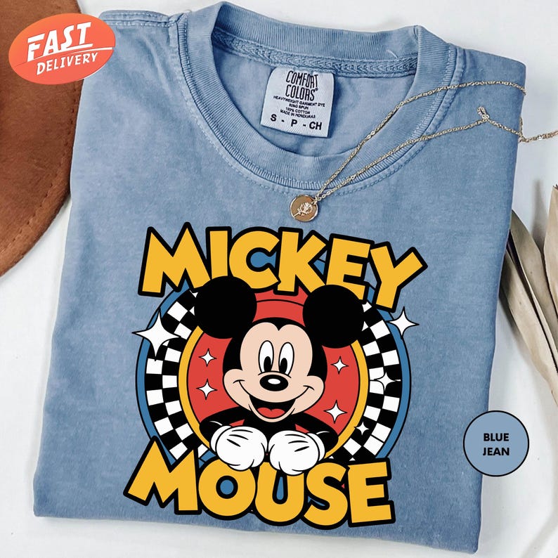 a mickey mouse t - shirt on a table