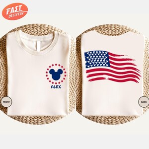 a pair of bibs with mickey mouse and american flag on them