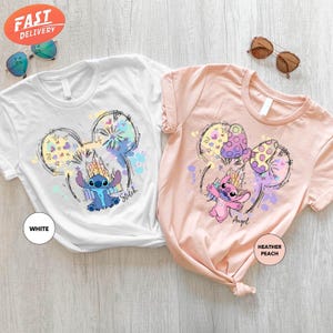 a pair of t - shirts with cartoon mouses on them