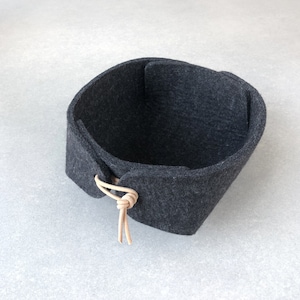 Small felt tray or organizer in charcoal black wool felt with natural leather toggles