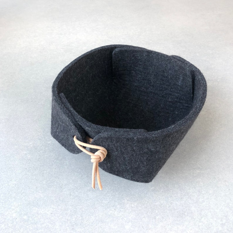 Small felt tray or organizer in charcoal black wool felt with natural leather toggles