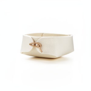 Small wool white felt catch all with  toggles in natural light tan leather Great for entry way drop.