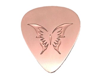 Copper Guitar Pick With a Recessed Butterfly Design