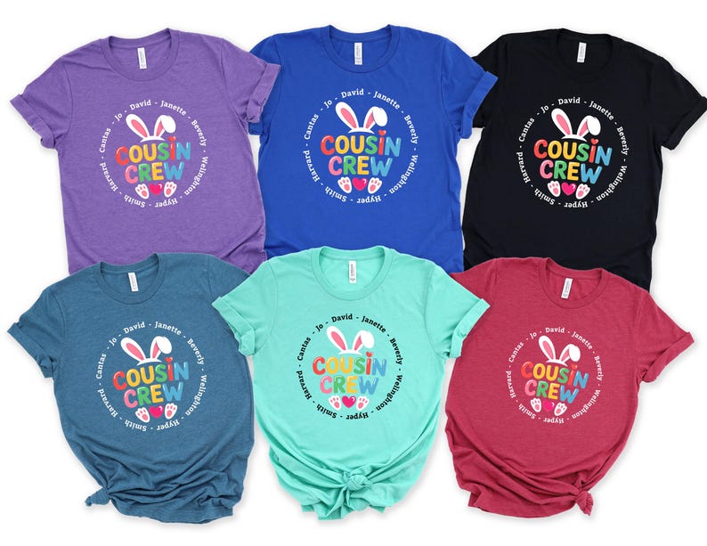 May include: Six short-sleeved t-shirts in shades of purple, blue, black, teal, green, and red. Each shirt displays a circular graphic with the words "COUSIN CREW" and bunny ears, with names encircling the design.