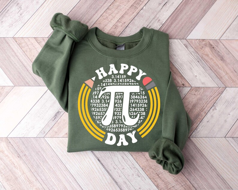 May include: A green sweatshirt with a white graphic design that says "Happy Pi Day" with a large pi symbol surrounded by numbers.