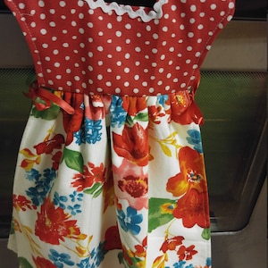 Pioneer. Woman Kitchen towel over the oven door