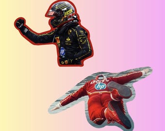 May include: Two race car drivers in their racing suits. One driver is wearing a black suit with yellow accents and a red helmet. The other driver is wearing a red suit with a white helmet. Both drivers are wearing the HP logo.