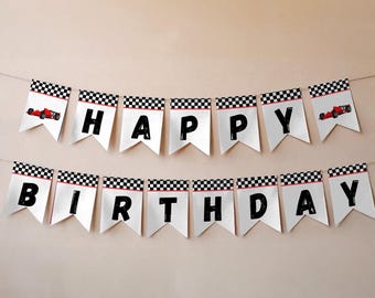May include: A white banner with black letters spelling "HAPPY BIRTHDAY". Each pennant has a checkered flag design and a red race car illustration. The banner is strung on a thin, light-colored string.