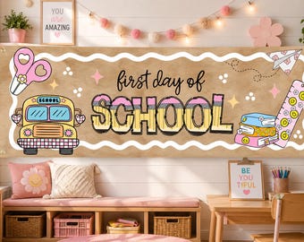 May include: A rectangular banner with a tan background featuring the text first day of SCHOOL in black and pencil-themed lettering. Illustrations include a yellow school bus, pink scissors, a stack of books, and a pink ruler with smiley faces.