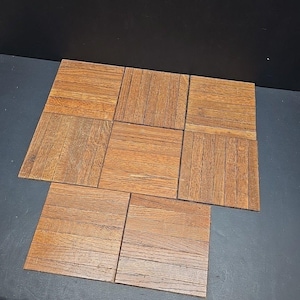 May include: A set of three ceramic mugs with a speckled, matte finish. The mugs are in shades of cream, light grey, and dark grey. Each mug has a simple, minimalist design, ideal for coffee or tea.