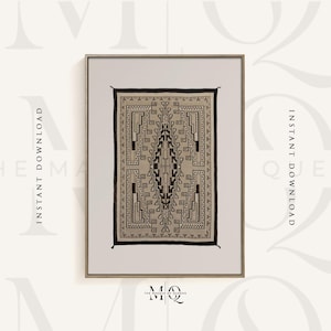May include: A framed print of a Navajo rug with a geometric pattern in black and white. The rug is in a light beige color and has a dark brown border. The print is framed in a light brown frame.