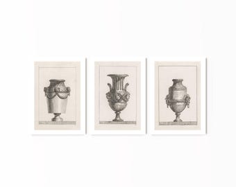May include: Three black and white line drawings of antique urns with decorative details. The urns are displayed in three separate frames.