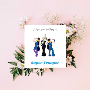 May include: A square greeting card featuring a white background with the black text I hope your birthday is and the blue text Super Trouper. The illustration depicts three figures in blue and black stage outfits holding microphones and singing.