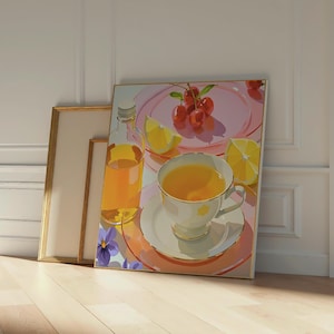 May include: A still-life painting featuring a cup of tea, cherries, and lemon slices on a pink plate. A bottle of orange liquid and a few purple flowers are also visible. The painting is in a gold frame and leans against a wall.