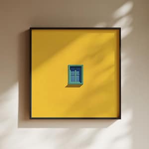 May include: A framed artwork depicting a small, teal window against a bright yellow backdrop. The window has a darker teal frame, and the artwork is enclosed in a black frame. The composition is simple, with shadows adding depth and interest.