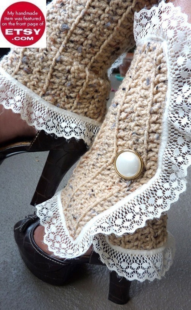 May include: Beige knitted leg warmers with white lace trim and a white button. The leg warmers are worn with brown heeled shoes.