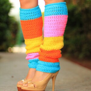 May include: A pair of colorful crocheted leg warmers with stripes of blue, pink, yellow, and orange. The leg warmers are worn with nude high-heeled shoes.
