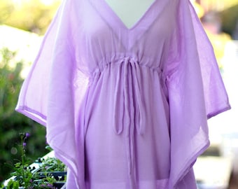 May include: A light purple, long, loose-fitting kaftan with a V-neck and a drawstring at the waist.