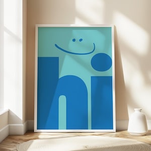 May include: A framed print with a blue and teal background featuring the word "hi" in large, bold, blue letters. A smiling face is drawn above the word.