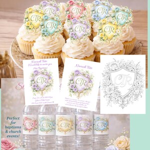 May include: Cupcakes topped with floral crests and invitations for a baptism. Water bottles with matching crests are also displayed. The crests feature the letters "CTR" and are surrounded by flowers. The text reads "Nevach Tate Would like to invite you Her Baptism".