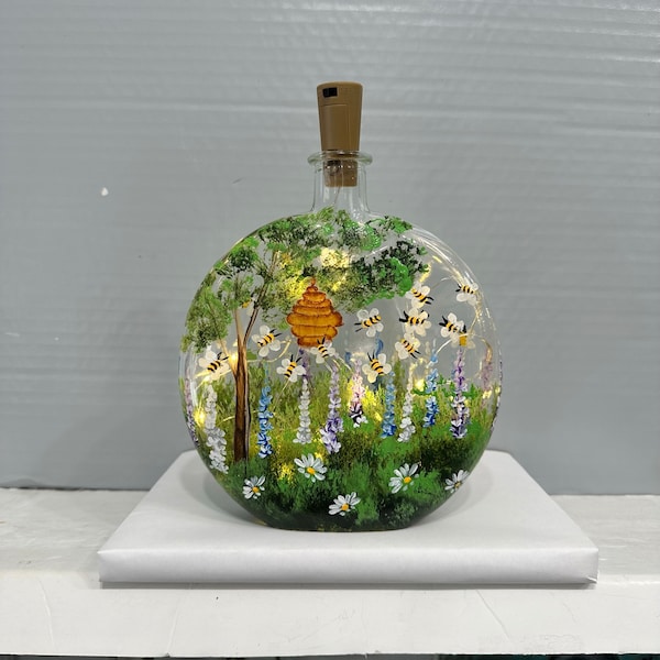 Bouteille lumineuse jardin avec abeilles