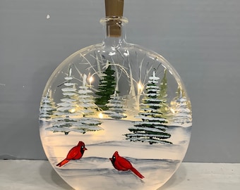 Bottle painted light winter scene birch and fur trees and cardinals in snow