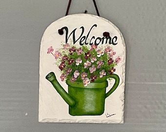 Slate welcome sign watering can with flowers