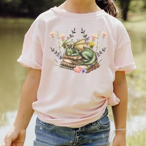 Dragon Lover Kids Tee  Cute Book & Flowers Shirt for Young Readers  Gift for Girls Who Love Dragons and Books Youth T-Shirt Unique Kids Tee