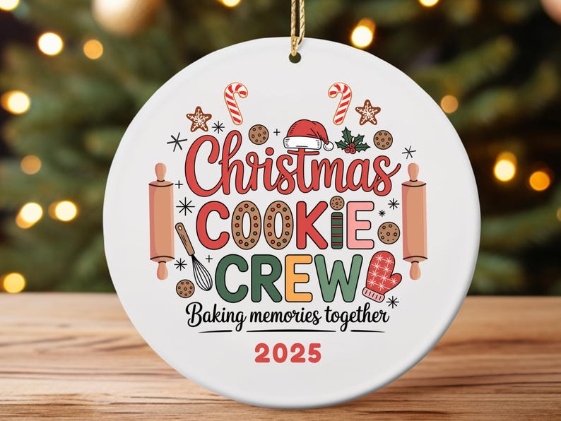 May include: White ceramic Christmas ornament with the text "Christmas COOKIE CREW Baking memories together 2025." The ornament features candy canes, cookies, a Santa hat, rolling pins, and a mitten.