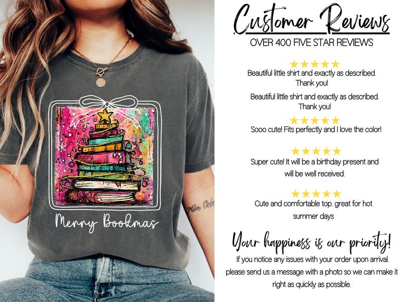 May include: Dark gray t-shirt featuring a colorful graphic of a Christmas tree made of books, with a star on top. The text "Merry Bookmas" is below the graphic.