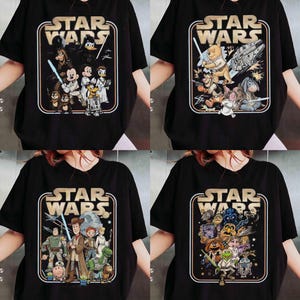 May include: Four black t-shirts featuring Star Wars graphics with various cartoon characters. Each shirt has a rectangular design with the words "STAR WARS" at the top. The characters include Mickey Mouse, Winnie the Pooh, and others.
