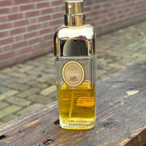 Make an offering 1970's Vintage Hermes Caleche Eau de toilette Splash for women 100 ml 3.3 fl. oz. Bottle 50% full. No cap