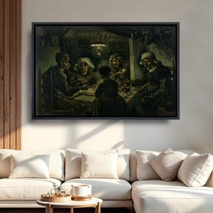 May include: A framed rectangular wall art print depicting a dark, moody interior scene with five figures gathered around a table eating a meal under a hanging lamp. The painting features muted earth tones, deep shadows, and a rustic aesthetic.