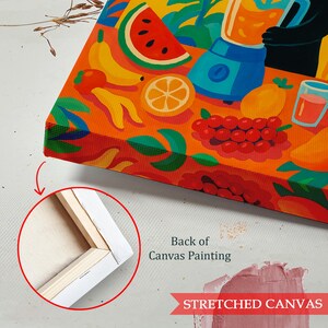 May include: A rectangular canvas painting featuring a vibrant illustration of assorted fruits including watermelon, bananas, oranges, and grapes, alongside a blue blender. An inset circle shows the wooden frame on the back of the canvas painting.