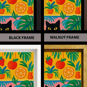 May include: A set of four framed art prints featuring a vibrant yellow background with illustrations of strawberries, apples, oranges, and green foliage. A black cat with yellow eyes is visible at the bottom. Frames are black, walnut, white, and gold.