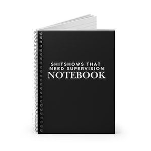 May include: Black spiral notebook with white text that reads "Shitshows That Need Supervision Notebook".