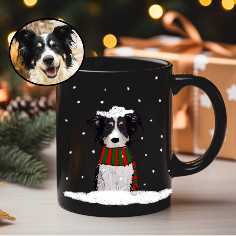 May include: Black ceramic mug with a white border and a cartoon dog wearing a red and green scarf in a snowy scene.